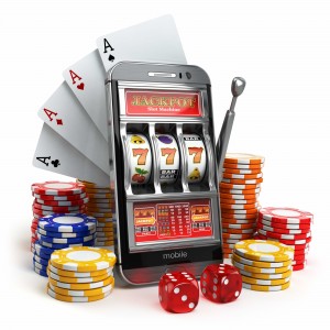 Online casino concept. Mobile phone, slot machine, dice and cards.